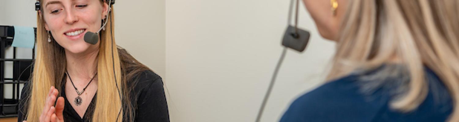 Student engaged in research and conversation