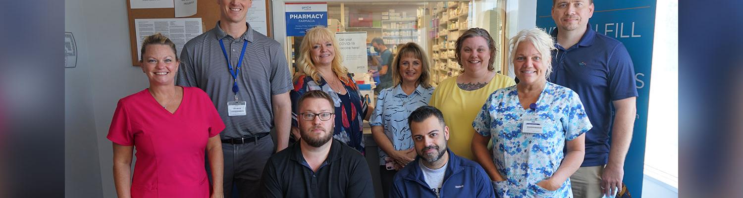 Group photo of the Integrated (Genoa/pharmacy; AxessPointe/Primary Care; Portage Path Behavioral Health/Community Mental health center) and Interprofessional Team (Psych-Mental health NPs; Family Medicine MD; Pharmacist and Pharmacy Techs)