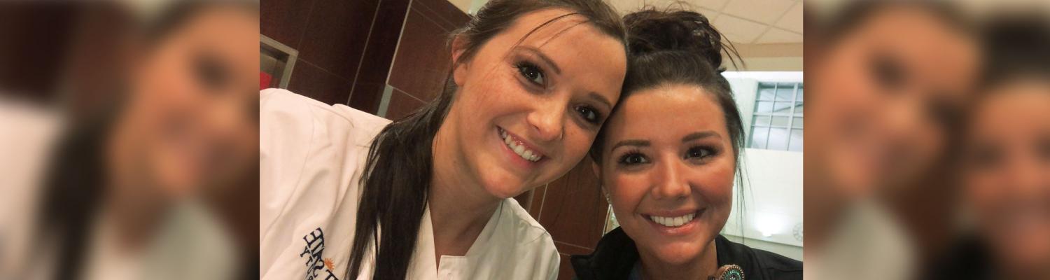 Photo of student (Shelbee) posed and smiling for the camera