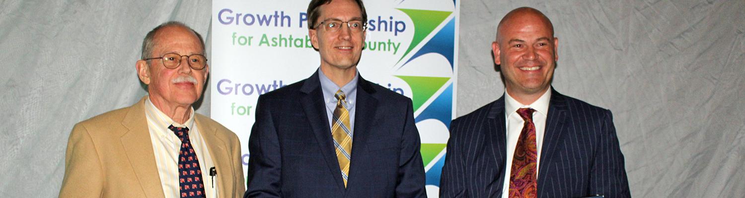 Ashtabula Interim Dean Bill Ayres (center) accepts the 2022 Best of the County Award