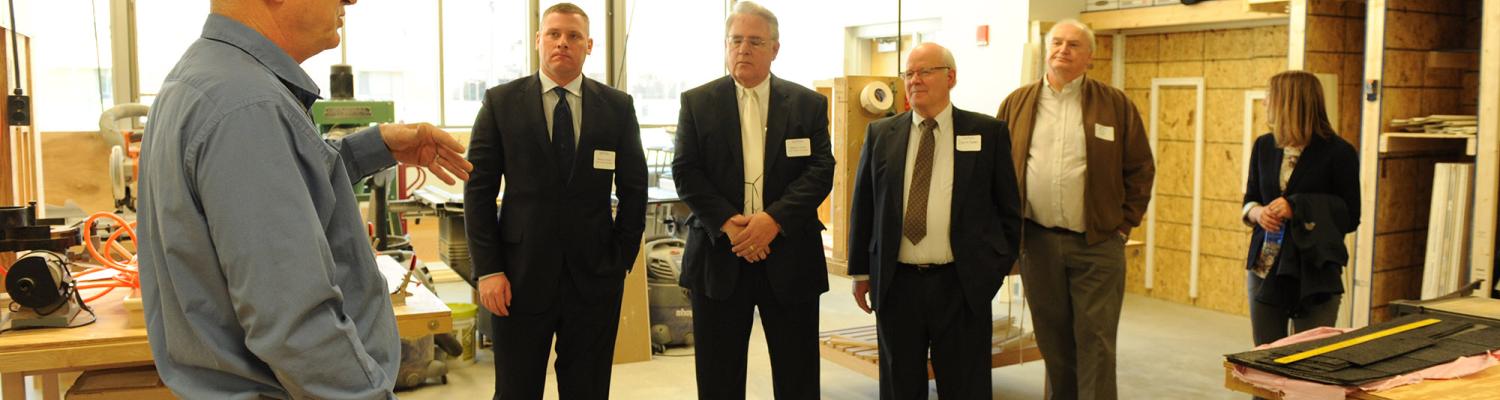 Donors  tour the construction management area in the Aeronautics and Technology building.
