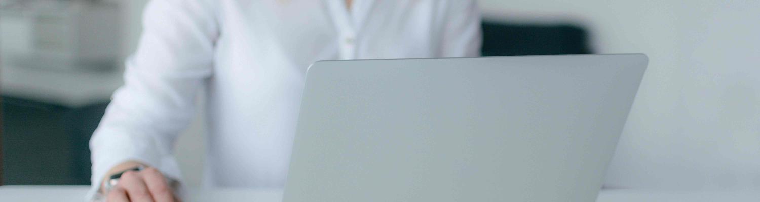 Student researching on a laptop 