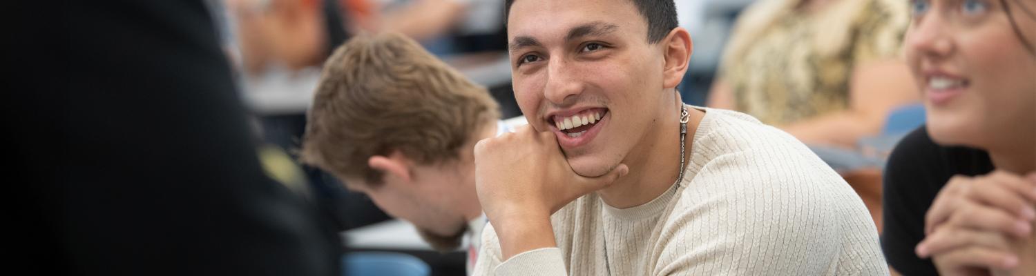 student laughing in class