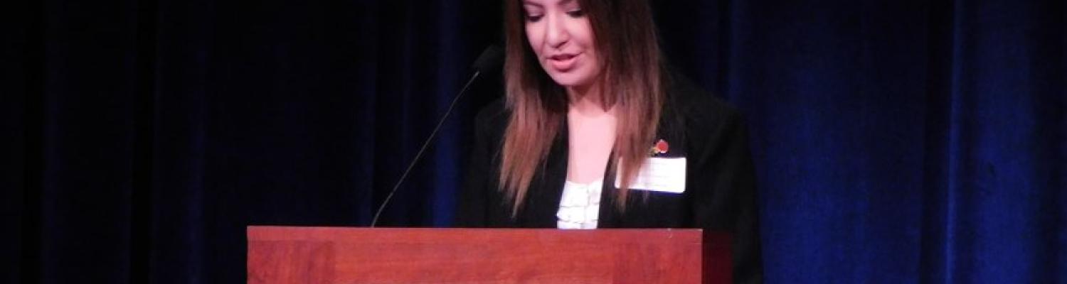 Jhannise Vaca Daza accepts her award as the Distinguished Honors Alumna for 2018.