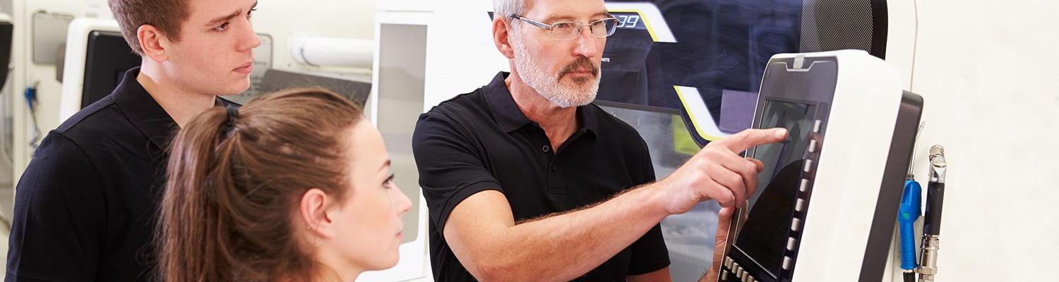Ohio TechCred engineer working with students on computer