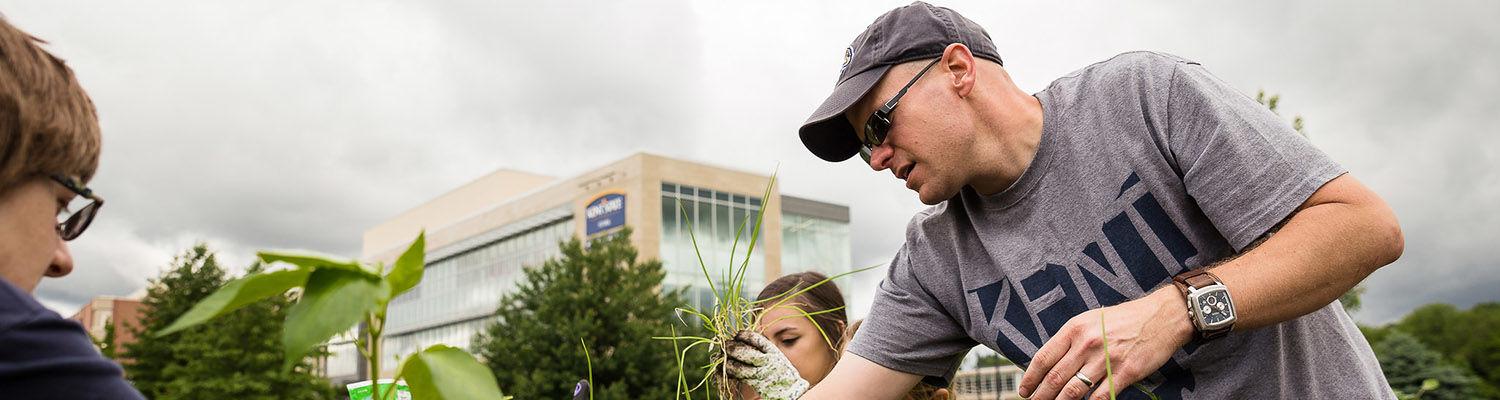 Environmental science students gardening plants