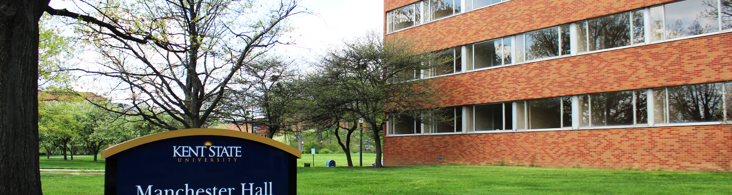 Outdoor view of Manchester Hall with building sign on display