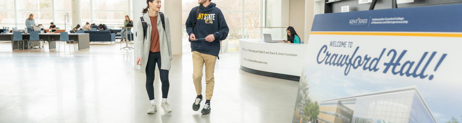 students walking in crawford hall atrium