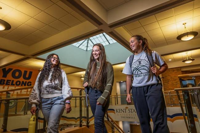 Students indoors walking as a group