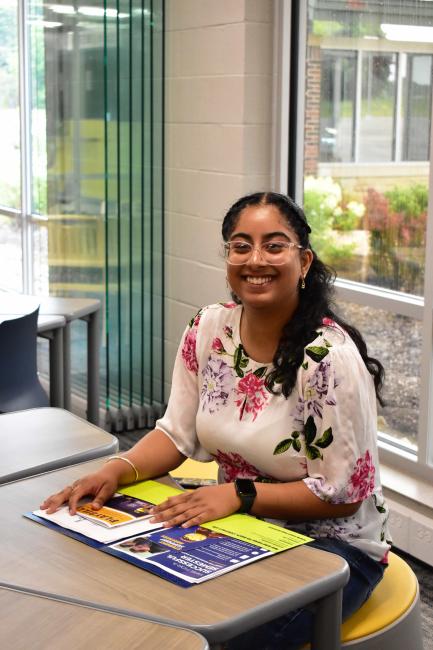 A student in a public study space on Geauga campus