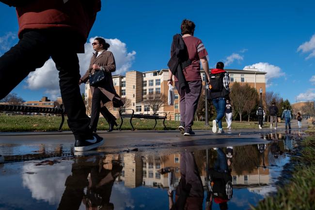 Students walking around Manchester field