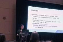 Photo of Ya-Fen Wang, Ph.D., RN presenting at an academic conference