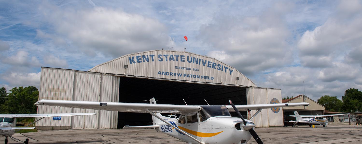 Kent State airplane with the hangar in the background. 