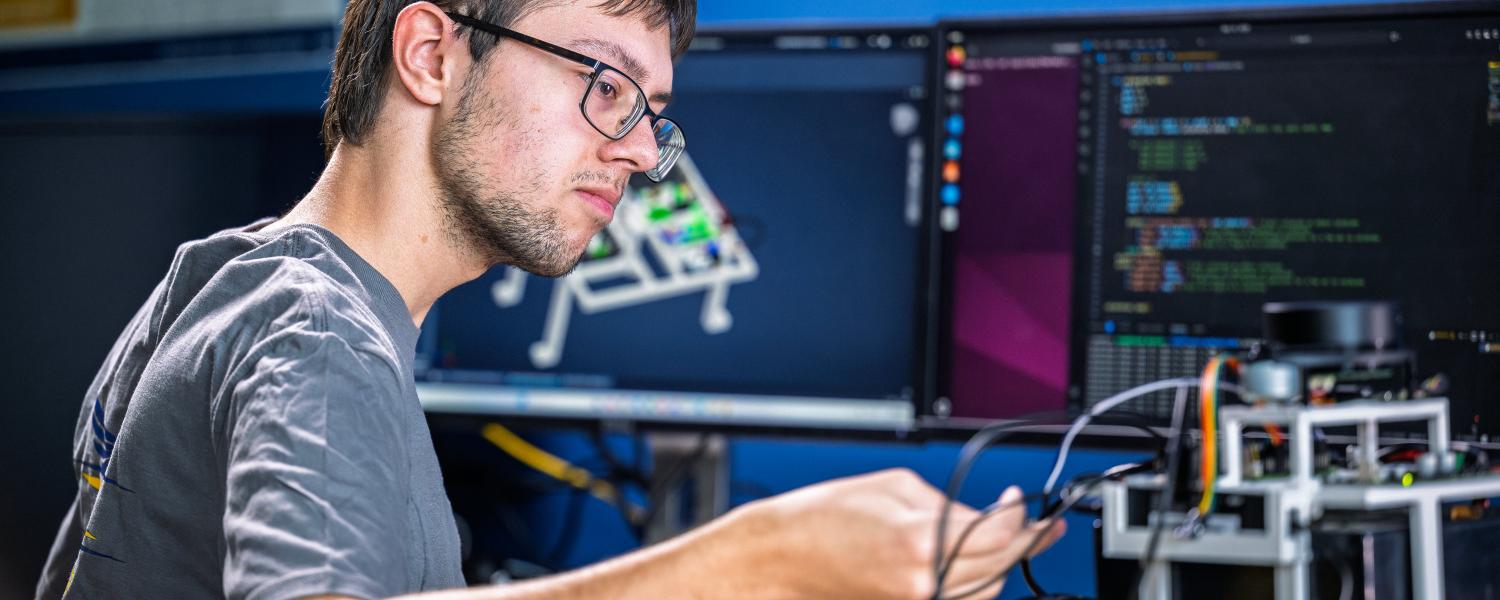 Student working in the Digital Engineering Design Center using the digital tools to help design and build a prototype.