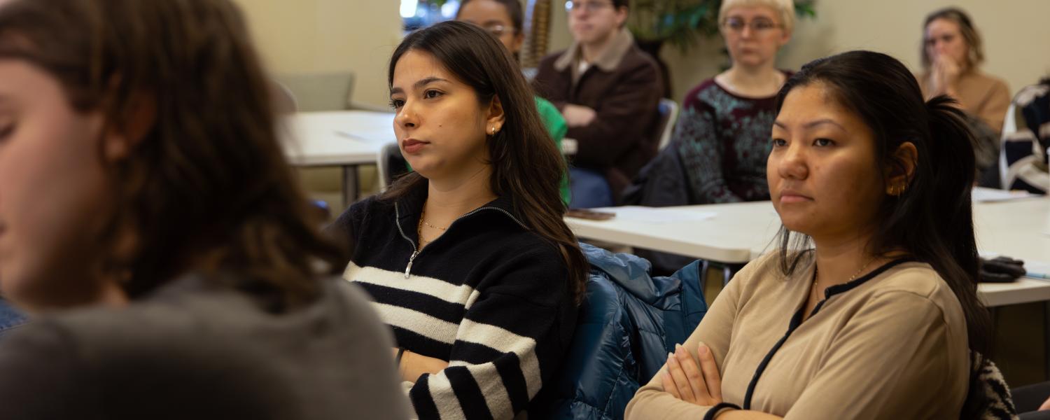 A group of Counselor Education and Supervision students sit and listen during an orientation presentation at Kent State.