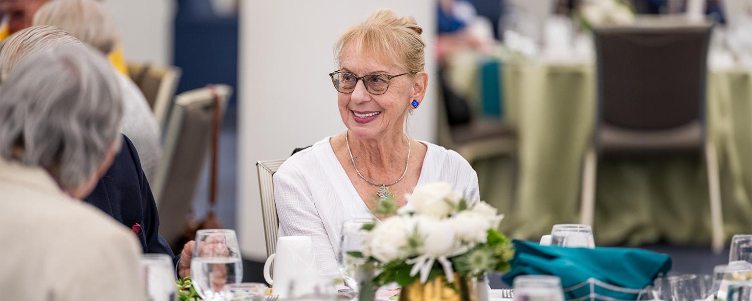 A member of the Herrick Society attends the annual luncheon in September 2025.