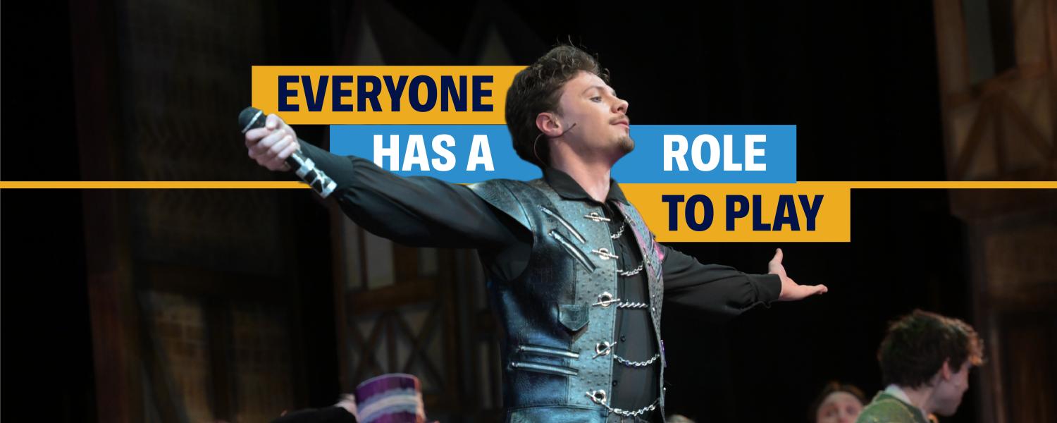 An actor performing on stage with the words "Everyone has a role to play"