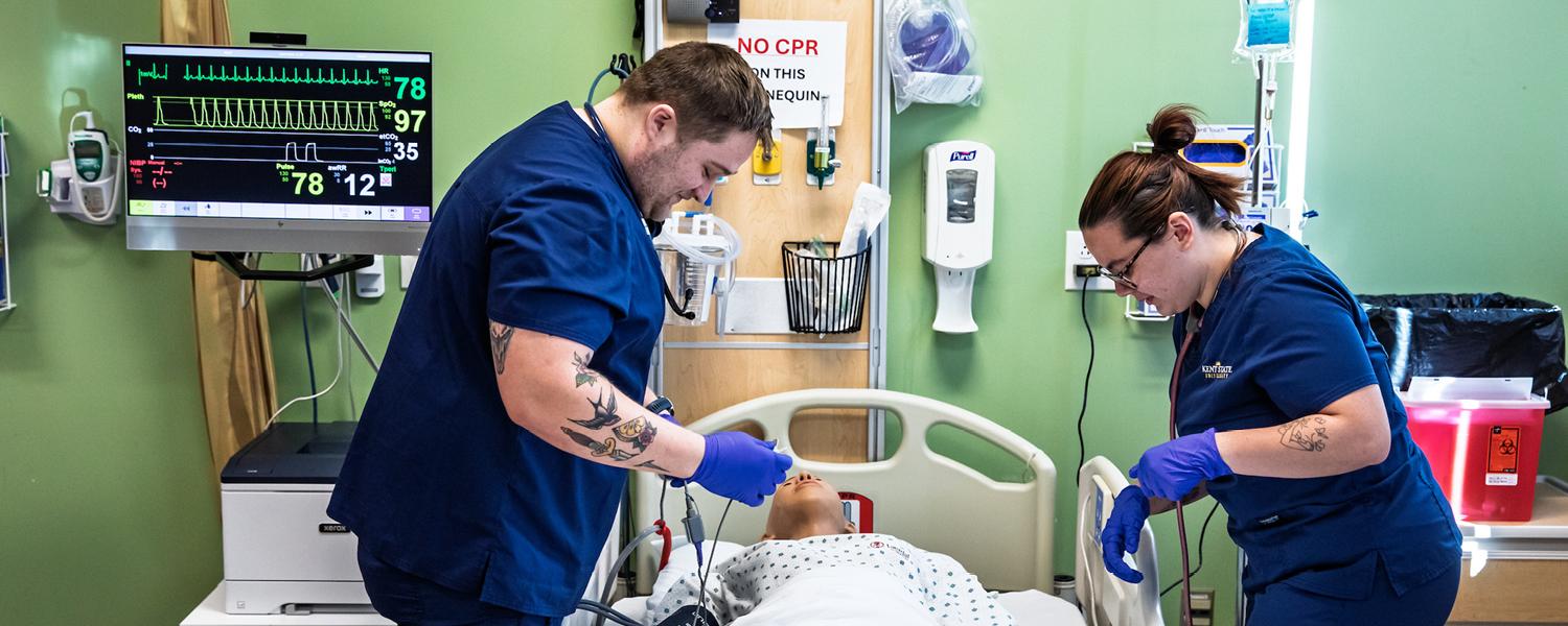 ADN Nursing Students practicing on a mannequin