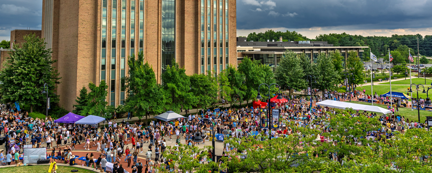 The outside area of the student center is full of students.