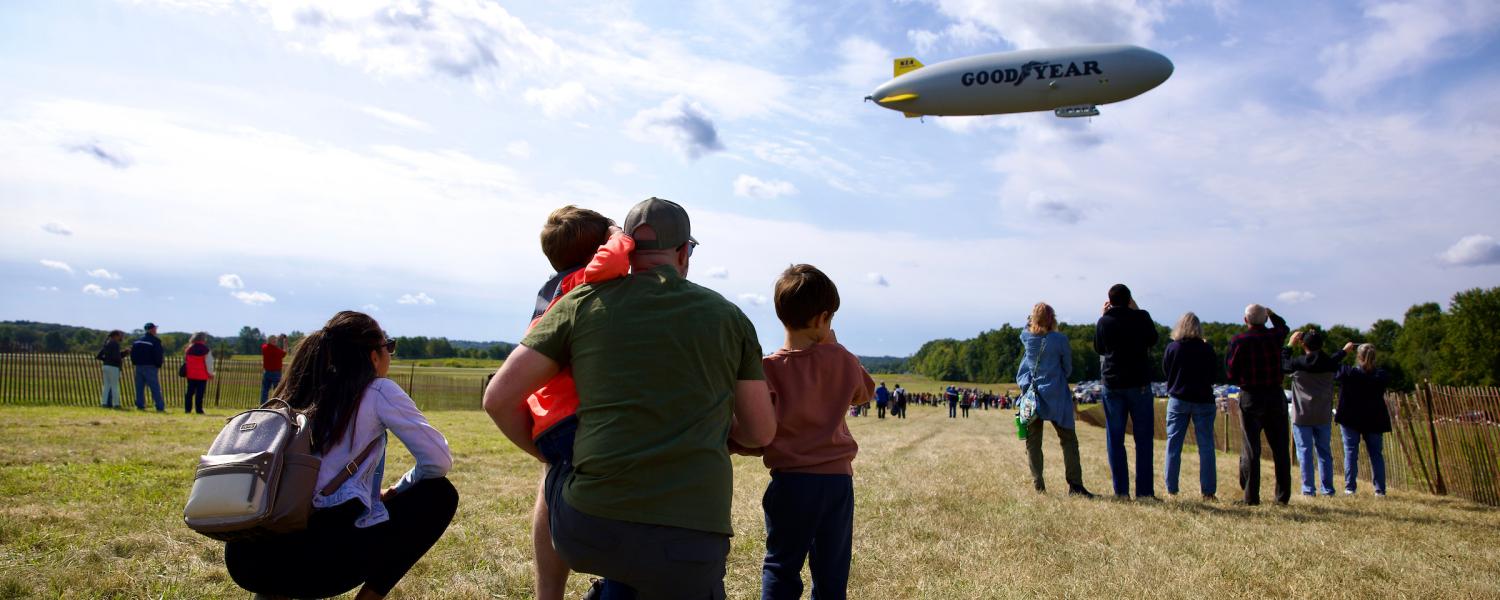 Visitors at ֱ State Airport View Goodyear Blimp During A&E Expo 2025