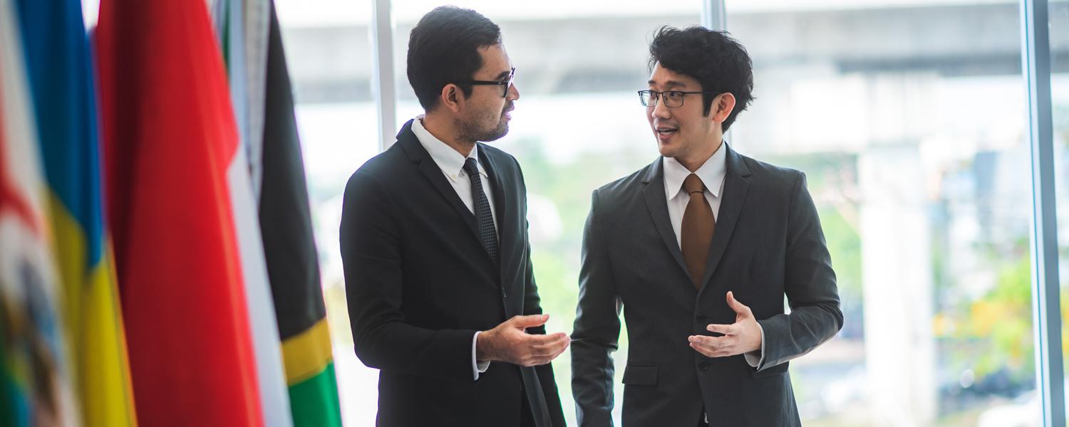 students speaking together at an international conference