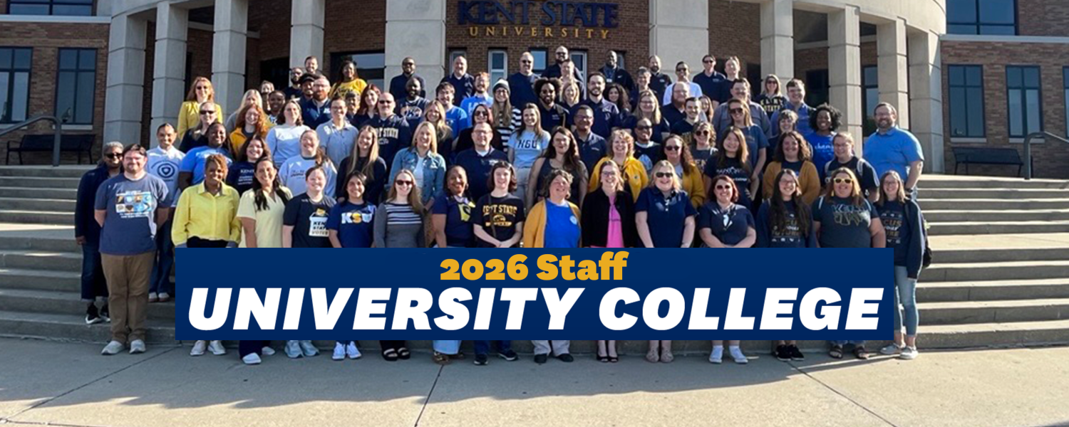 The entire University College staff stands in front of the MACC building on campus.