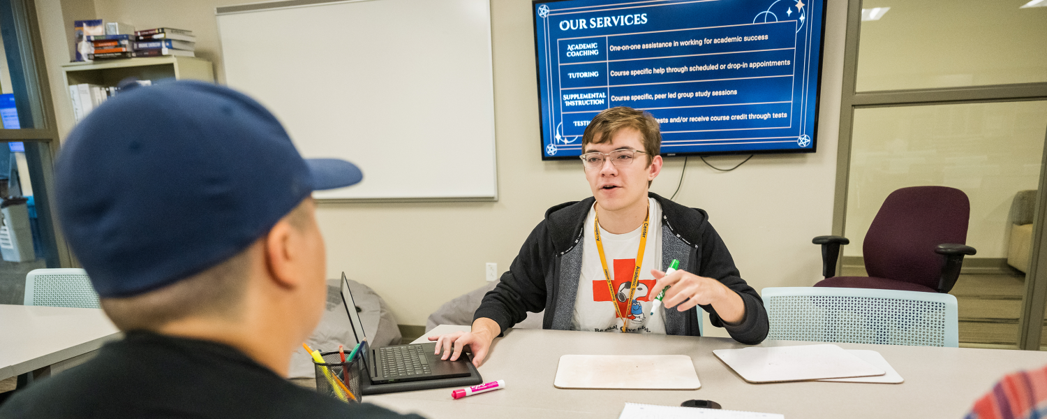 A tutor works with a student in the Academic Success Center.