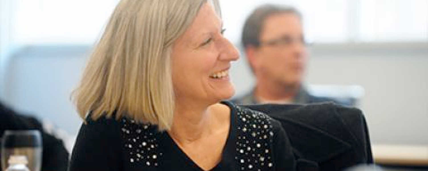 A program participant pays close attention to a speaker.