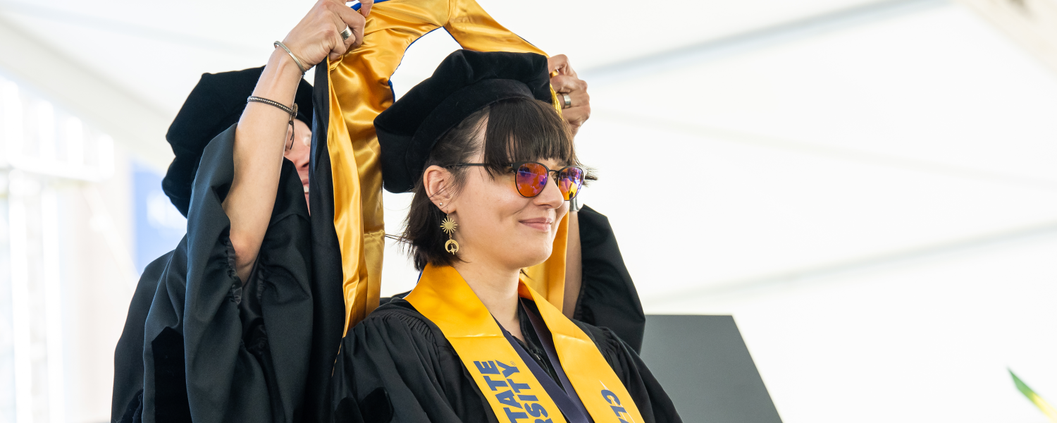 Student being hooded at graduation 