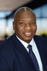 Professional headshot of Dominque Hill