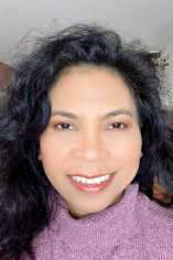 Headshot of Dena Mae Agra-Koojiman.