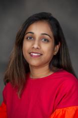 Woman with dark hair and red blouse
