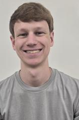 picture of a male student wearing gray t-shirt