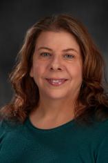 Headshot of Dr. Lynette Phillips with dark grey background