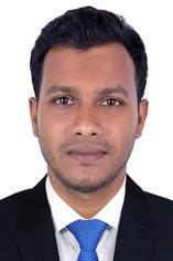 image of male student wearing a business suit with blue necktie
