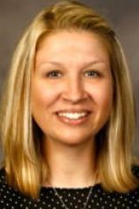 Shannon Reesh smiles in a professional headshot against a neutral background.