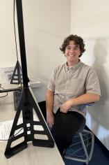 Ethan Montoya sitting next to cleartouch