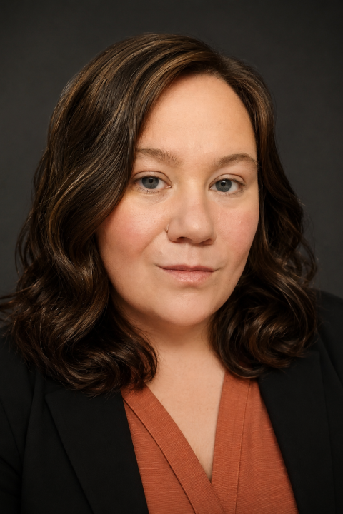 Profile headshot photo of Elizabeth Kudravy.