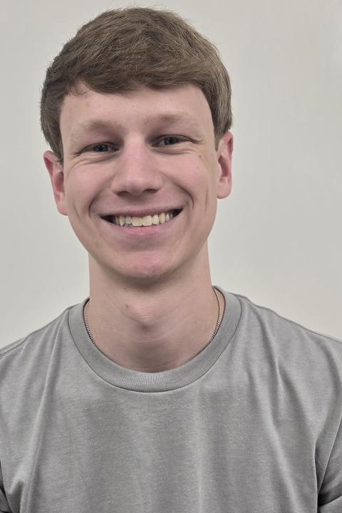 picture of a male student wearing gray t-shirt