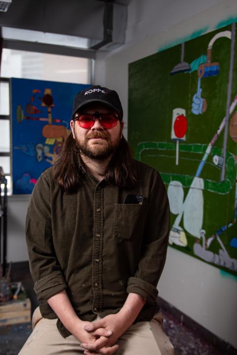 austin peer sitting in an art studio