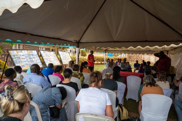 Students sitting for a presentation in Rwanda