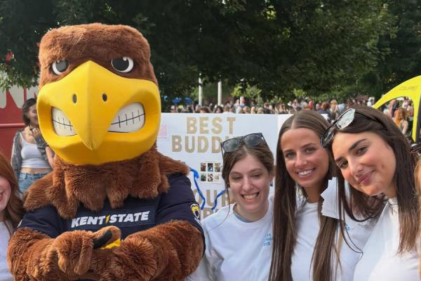 Kent State University Best Buddies members take a photo with Flash at Blastoff.