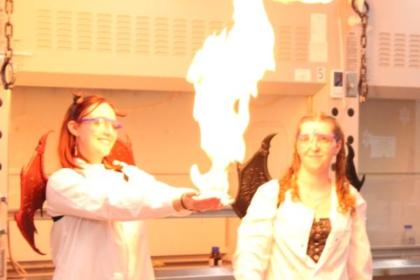 Chem-O-Ween 2025 student's "hand" on fire