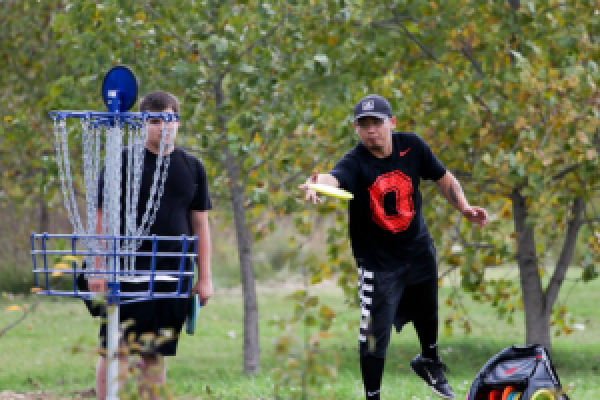 A person playing disc golf.