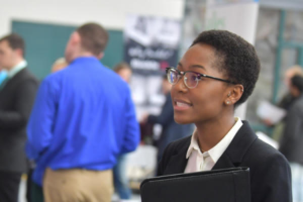 A student attending the Graduate Fair.