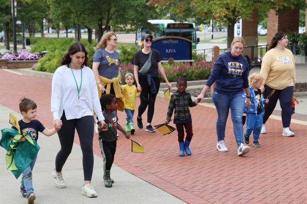 CDC staff members and children walking the Walk-a-thon.