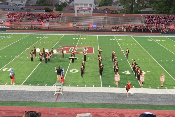 marching band performing on a football field
