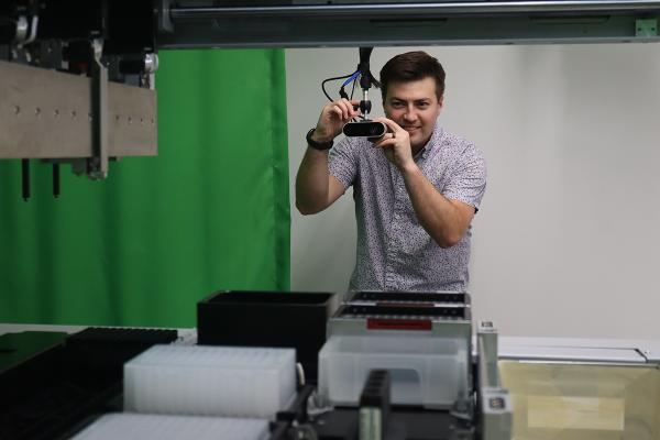 David E. Silva adjusts a volumetric camera