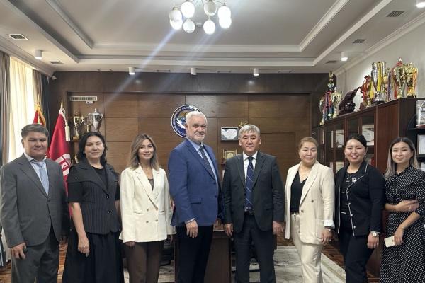 Officials from Kent State's Office of Global Education meet with officials from Osh State University in Osh, Kyrgyzstan.