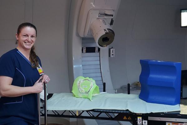 Jill-Cofojohn-in-a-proton-therapy-treatment-room.jpg